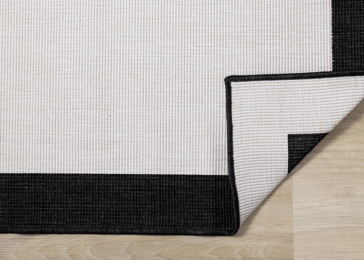 Summer Breeze 5'3" x 7'7" Reversible Outdoor Rug - Cream, Black Border - Image 4